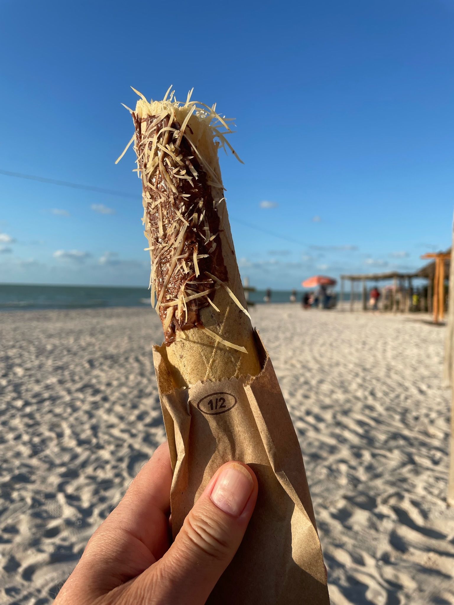 A photo of a marquesita dessert on the beach at Celestun, Yucatan.