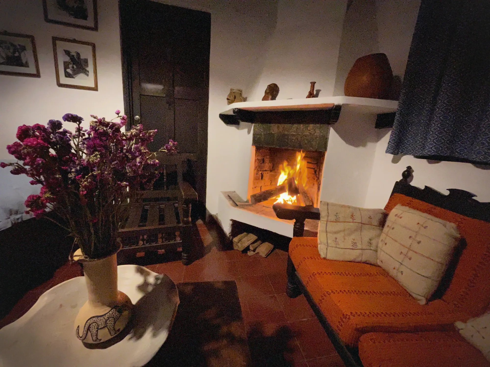 A log fire rages in the fireplace of the cozy Casa Na Blom museum hotel, San Cristóbal de las Casas